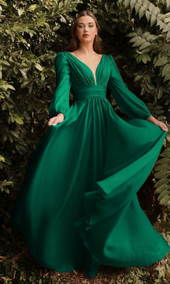 A woman stands outdoors before leafy greenery, wearing the Ladivine CD0192 Long Sleeve Flowy Long Prom Dress featuring an emerald green A-line silhouette and deep V neckline.