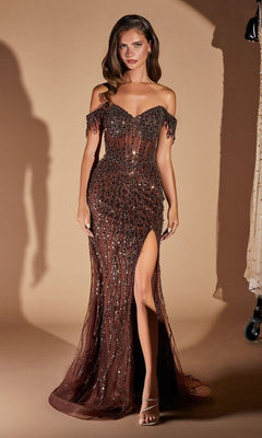A woman models the Sheer-Bodice Long Sequin Prom Dress CD0203 in espresso, featuring an off-the-shoulder design, sheer bodice, sequins, and a thigh-high slit, standing gracefully against a beige backdrop.