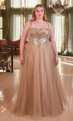 A woman stands indoors wearing the Plus-Size Sequin-Bodice Long Prom Dress CD0217C, featuring a gold sparkly sequin bodice and tulle skirt. Chandeliers and green curtains are visible in the background.