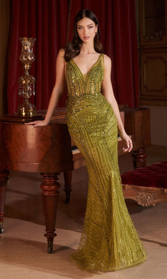 A woman in the Long Formal Dress CD0232 by Ladivine—a sleeveless, olive-green, sequin, floor-length gown with a v-neckline—stands by a wooden piano in an elegant room with red curtains.