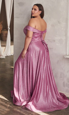 A woman wearing the Plus-Size Long Metallic Lace-Up Prom Dress CD210C in shimmery pink stands indoors with her back to the camera.