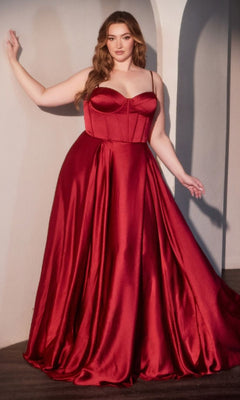 A woman poses indoors in the Ladivine CD337C, a plus-size long A-line prom dress featuring a sleeveless, fitted bodice and full skirt in striking red satin.