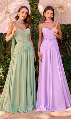 Two women stand outdoors holding parasols, each wearing the Ladivine CD395 long prom dress—one in light green, the other in lavender—with a-line skirts. Lush greenery can be seen in the background.