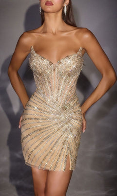 A woman stands confidently with hands on hips, wearing the Ladivine CD646—a strapless gold sequin mini homecoming dress featuring a swirl pattern, corset bodice, crystal and beaded details, plus a small slit.
