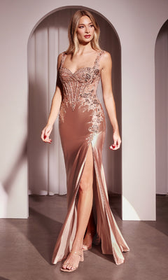 A woman in the Beaded-Lace Corset Long Prom Dress: Ladivine CD775, featuring rose gold beaded lace, floral embroidery, a sleeveless design, and a thigh-high slit, stands before white archways.