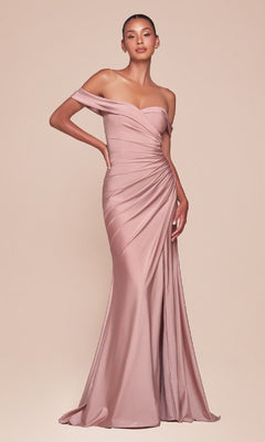 A woman wears the Ladivine CD790, an off-the-shoulder long prom dress in blush pink with ruched detailing and a fitted silhouette, posing elegantly against a neutral background.
