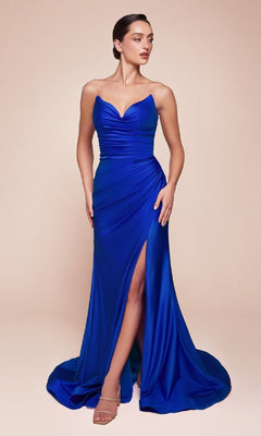 A woman models the Lace-Up Strapless Long Prom Dress: Ladivine CD791 in royal blue, featuring a sweetheart neckline, ruched bodice, thigh-high slit, and lace-up open back. She pairs it with nude heels against a plain beige background.
