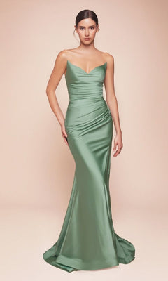 A woman faces forward in the sage green Ladivine LCD791 Lace-Up Strapless Long Prom Dress, floor-length and light green satin with a sweetheart neckline and booty-contouring ruching. The background is plain, light beige.