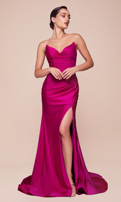 A woman models the magenta Lace-Up Strapless Long Prom Dress: Ladivine CD791, featuring booty-contouring ruching, a high slit, and an open lace-up back, as she stands against a plain beige background.