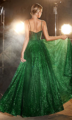 Wearing the Sheer-Bodice Long A-Line Shimmer Prom Dress CD832, a person poses under bright studio lights, holding out the full skirt. The fitted bodice and thin straps accentuate the shimmering green formal dress, photographed from behind.