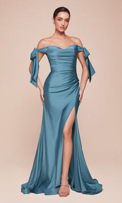 A woman stands against a plain beige background wearing the Off-Shoulder Ruched Prom Dress: Ladivine CD943 in blue, featuring off-the-shoulder sleeves, a side slit, and bow details.
