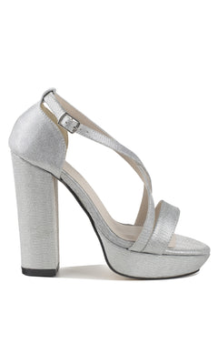 The Chloe Silver Shimmer Prom Shoes: Touch Ups 4647 are high-heeled platform sandals with an ankle strap, buckle, trendy block heels, and textured material—a stunning, elegant pick for prom.