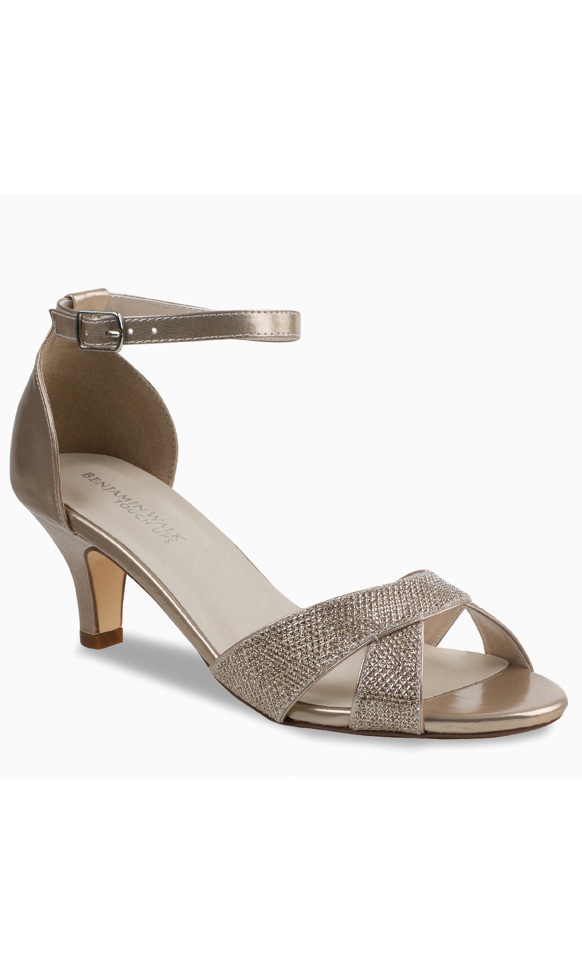 Clementine Champagne Glitter Prom Shoes (Touch Ups 4614) feature gold low heels, an open toe, ankle strap, and crisscross champagne glitter straps—ideal chic kitten heels for prom or special occasions.