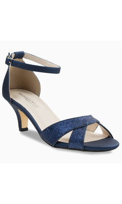 The Clementine Navy Blue Glitter Prom Shoes by Touch Ups 4616 are sparkling women’s open-toe sandals with a low heel and ankle strap, perfect for those seeking elegant navy blue prom shoes with comfort and style.
