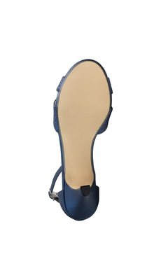 The Clementine Navy Blue Glitter Prom Shoes (Touch Ups 4616) are displayed from the bottom, showing a smooth beige sole and ankle strap against a white background.