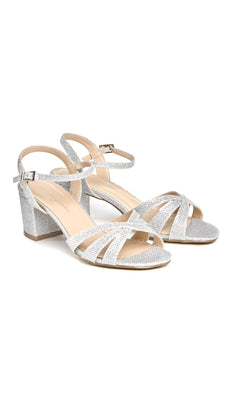 Colette Sparkly Silver Prom Shoes: Paradox London P1801 feature open toes, block heels, ankle straps, and a crisscross front design, shown here on a white background.