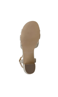 The image shows the bottom view of the Colette Champagne Prom Shoes: Paradox London P1802, a beige flat sandal with a textured sole, small heel, and subtle sparkly details.