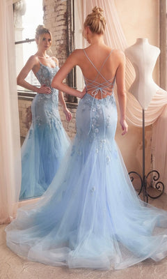 A woman in the Long Pastel Floral Mermaid Prom Dress D145 stands before a mirror next to a dress form in a softly lit room.