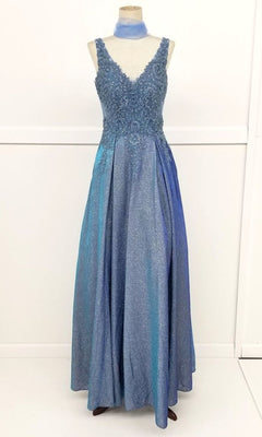 The Lace-Bodice Long Glitter Prom Dress (Chicas DM4017) is a sleeveless, floor-length blue evening gown with a beaded bodice, V-neckline, and glittery flowing skirt displayed on a mannequin.