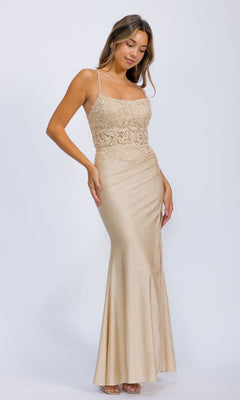 A woman wears the Lace-Corset Long Jersey Prom Dress: Eureka EK129, a light gold, floor-length gown with spaghetti straps and a corset-style bodice, standing against a plain white background.