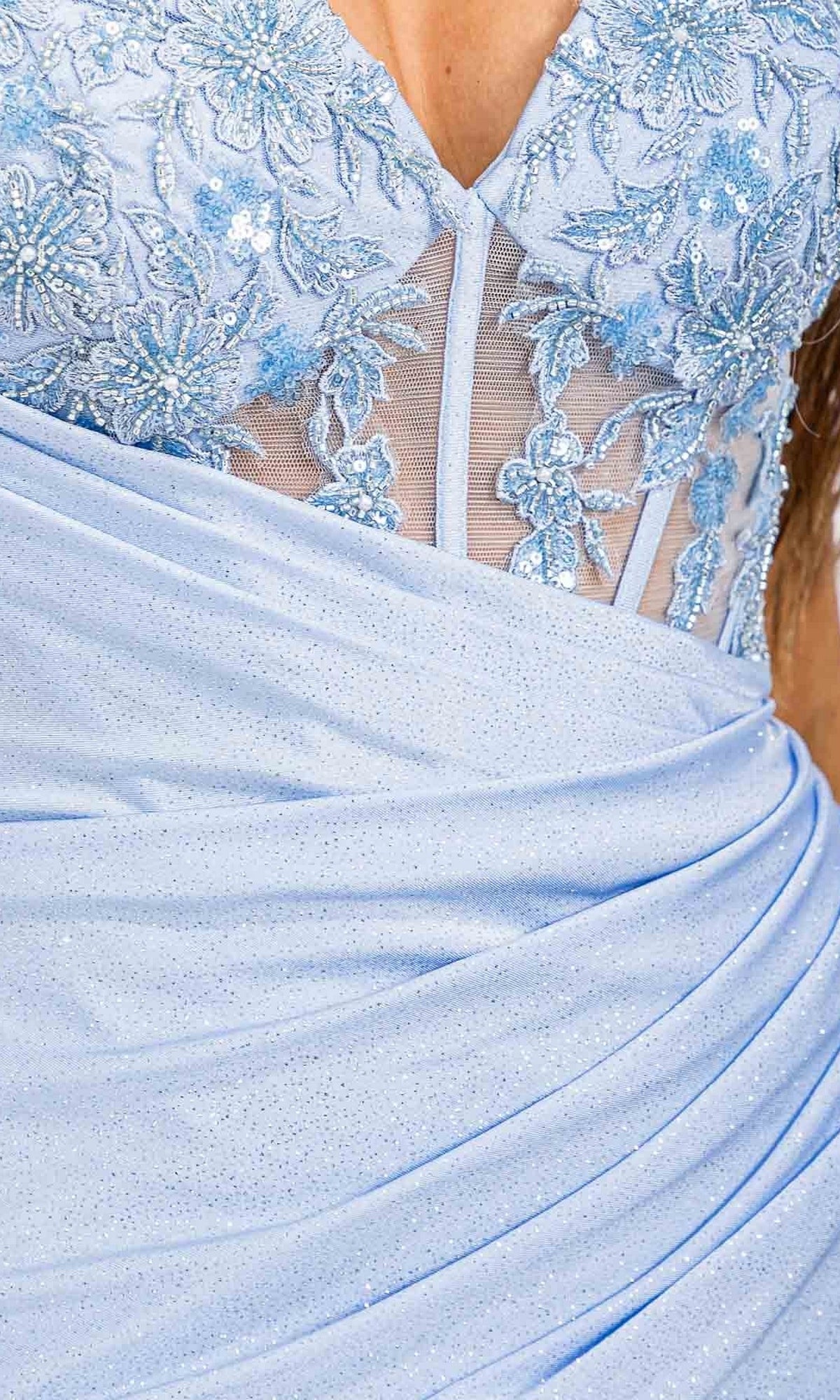 Close-up of the Short Homecoming Dress: Eureka EK163 in light blue, featuring floral lace embroidery, sheer mesh bodice panels, and a draped sparkly skirt.