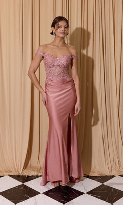 A woman wearing the Eureka EK173 Long Prom Dress with a lace bodice and slit skirt stands on a black and white tiled floor in front of beige curtains.