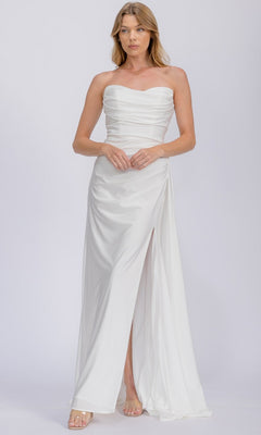 A woman in the Eureka EK178 long prom dress with a strapless, fitted bodice, ruched details, and a high slit stands against a plain light background.