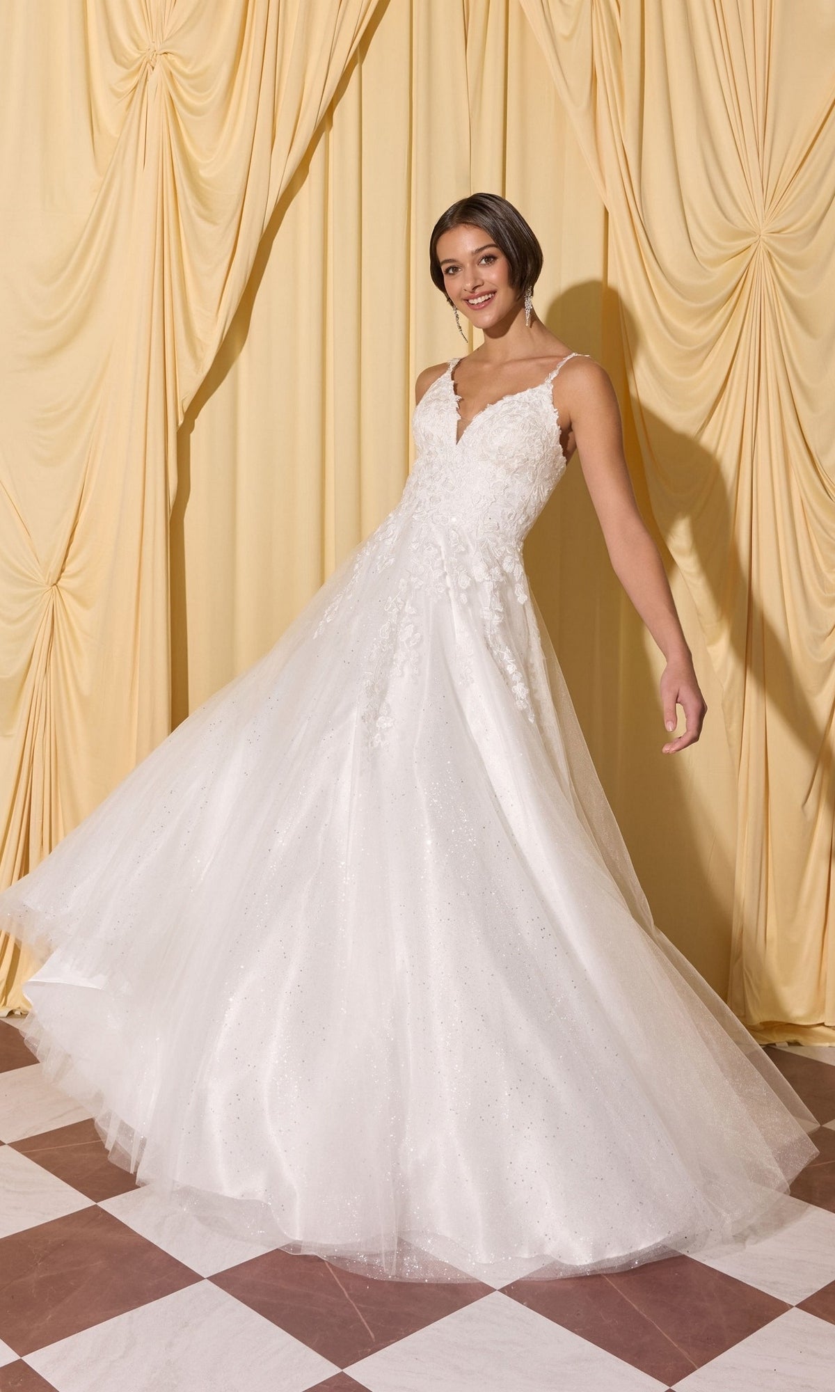 Woman in floor-length Long Prom Dress: Eureka EK210 with 3D floral appliques and full tulle skirt, standing on a checkered floor by beige curtains.