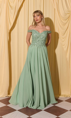 A woman wearing the Long Prom Dress: Eureka EK211 with a lace applique bodice stands on a checkered floor before yellow draped curtains.