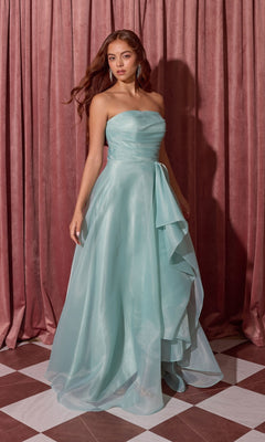 Woman wearing the Long Prom Dress: Eureka EK216, a strapless light blue gown with a layered A-line skirt, on a checkered floor before pink curtains.