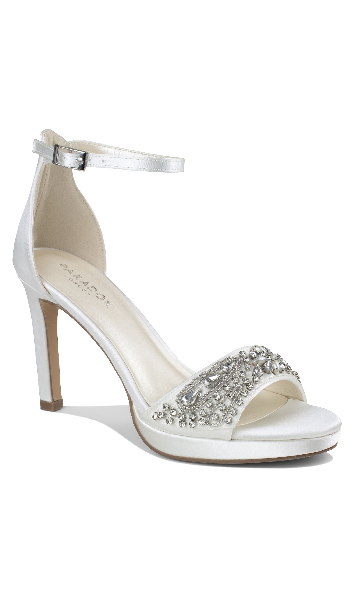 The Enya Ivory Satin Prom Shoes by Paradox London (P2203) are white high-heeled sandals with an ankle strap, open toe, and sparkling silver rhinestones—ideal jeweled stiletto heels for formal events.
