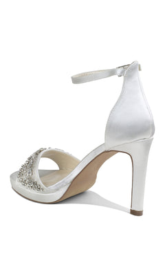 The Enya Ivory Satin Prom Shoes by Paradox London (P2203) feature a high heel, ankle strap, open toe, and dazzling jeweled stiletto heels with decorative rhinestones on the front strap.