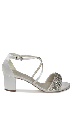 The Evangeline Ivory Satin Prom Shoes by Paradox London (P2200) feature a white satin block heel, ankle strap, and rhinestone-embellished toe—perfect for an elegant prom look.