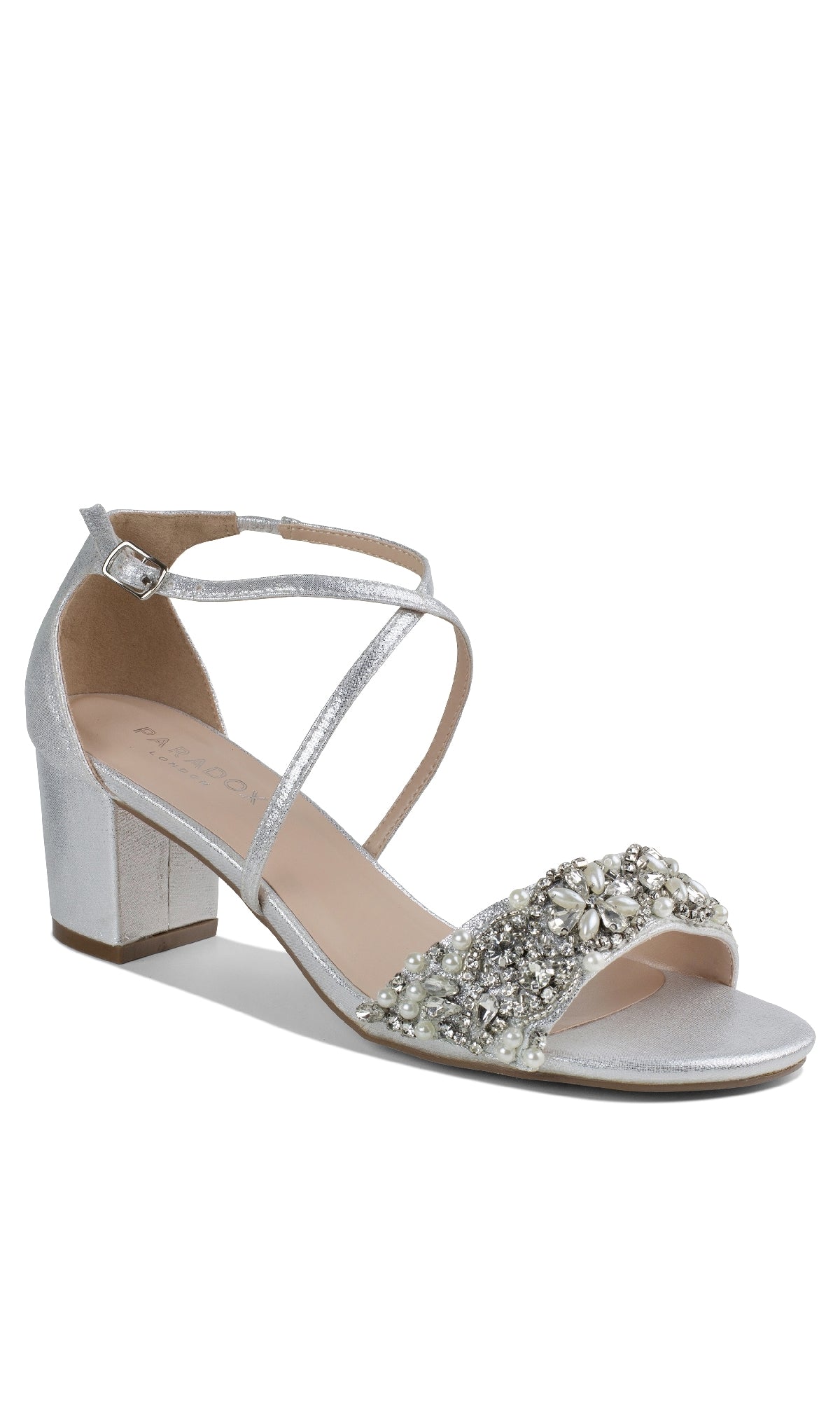 The Evangeline Silver Prom Shoes: Paradox London P2201 feature a block heel, ankle strap, cross straps, and sparkling rhinestone embellishments—ideal as low-heel silver formal shoes for prom or any special event.