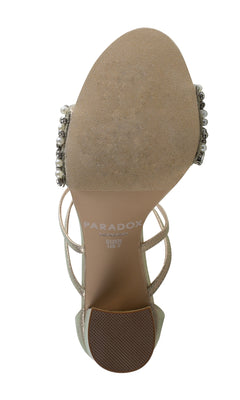 The Hira Champagne Prom Shoes by Paradox London (P2102) are women's sandals featuring a beige sole with "PARADOX LONDON" branding and US size 7 marked, plus beaded jeweled block heels and gem embellishments on the sides.