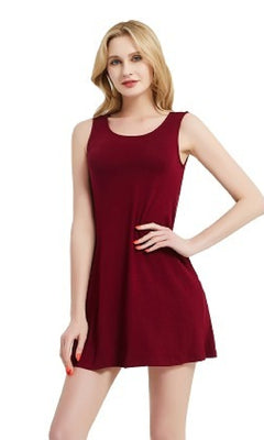 A woman models the Sleeveless Casual Short T-Shirt Dress with Pockets, standing with one hand on her hip against a plain white background.