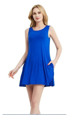A woman wears the Sleeveless Casual Short T-Shirt Dress with Pockets in royal blue, standing against a white background.