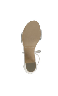A top-down view of the sole of the Ines Ivory Satin Prom Shoe by Paradox London (P2224), a women’s open-toe style with ankle strap, showing the brand’s name on the insole.