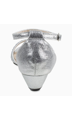 Rear view of Iris Silver Wedge Prom Shoes: Touch Ups 4626—a metallic silver closed-heel shoe with an ankle strap and low, tapered block heel, ideal for anyone seeking elegant and stylish silver wedge prom shoes.