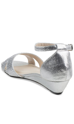 The Iris Silver Wedge Prom Shoes: Touch Ups 4626 are open-toe silver sandals with an ankle strap, viewed from the back and above—ideal for anyone seeking elegant prom footwear.