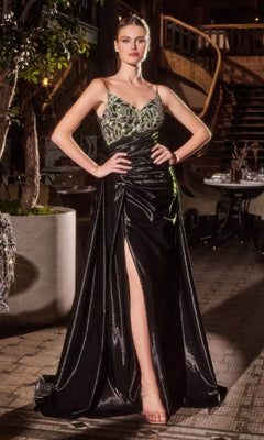 Woman poses outdoors in the Ladivine J882 Jacket Long Black Formal Dress, featuring a beaded bodice and thigh-high slit, exuding confidence with hands on hips.