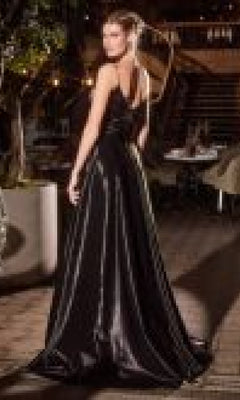 A woman in the Jacket Long Black Formal Dress: Ladivine J882 stands outdoors, facing away and glancing over her shoulder.