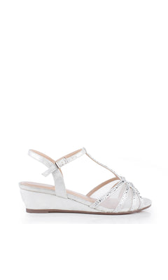 The Jilly Silver Prom Shoes: Paradox London P2001 feature beaded, glittery crisscross straps, an ankle strap, and low open-toe wedge heels—perfect formal silver sandals for prom. Shown on a white background.