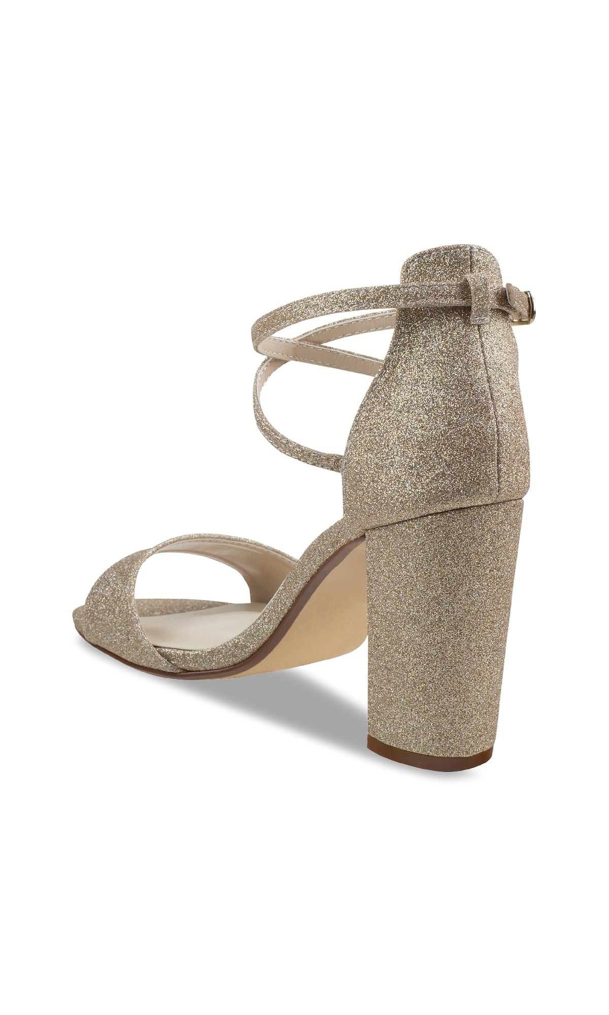 The Jordy Champagne Glitter Prom Shoes by Touch Ups (4630) feature a gold glittery block-heel sandal with an ankle strap, viewed from the side and slightly behind—perfect for making a statement at your next special event.