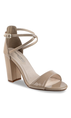 The Jordy High Heel Nude Prom Shoes by Touch Ups 4632 feature a beige patent leather block heel, ankle strap, and open toe—ideal for a chic prom look.