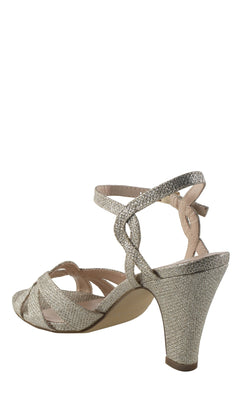 The Kitty Champagne Prom Shoes: Paradox London P2106 features a single open-toe shoe with a glittery champagne finish, crisscross ankle straps, and a closed heel, displayed against a plain white background.