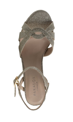 The Kitty Champagne Prom Shoe by Paradox London (P2106) is a single open-toe sandal with crisscross straps, low heel, ankle buckle, and "PARADOX LONDON" branding on the insole.