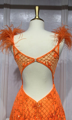 A mannequin showcases the Feathered Neon Orange Long Sequin Prom Dress KV1076, featuring dazzling sequins in a grid pattern, feathered shoulder straps, and a low open back.