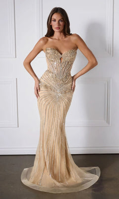 A woman poses in the Ladivine KV1139 Strapless Long Glitter Prom Dress, a form-fitting gold gown adorned with glitter, against a white panelled wall.