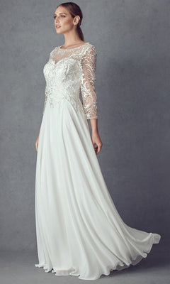 A woman models the Long Formal Dress: Juliet M11 in off white, featuring an embroidered bodice and lace detailing on the three-quarter length sleeves, set against a gray background.